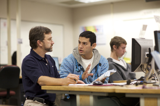 Instructor working with student