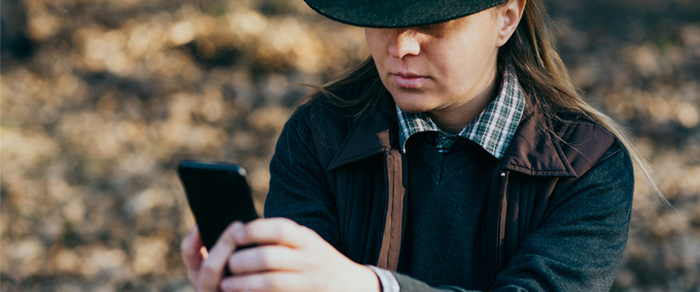 Native American man making a phone call