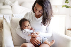 Image shows a Black mother and baby