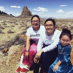 Image shows two Navajo women and a Navajo girl