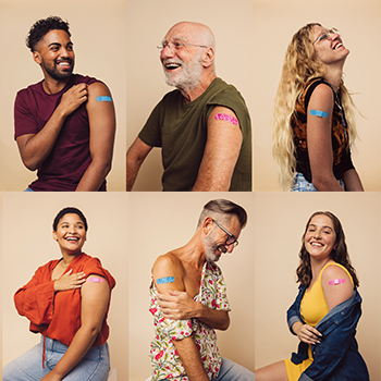 Image shows several people showing that they have received a COVID vaccine