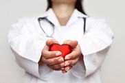 a doctor holding a heart icon