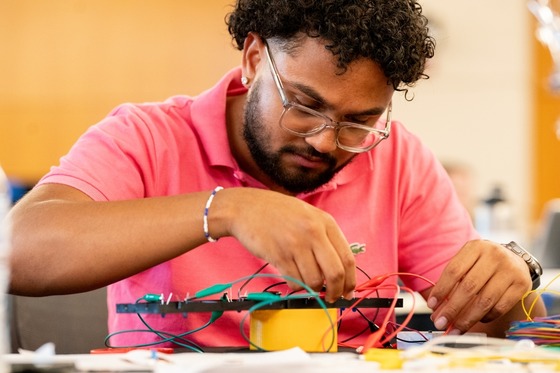 An NSTI 2024 participant working on an invention during the Invention Challenge activity. 