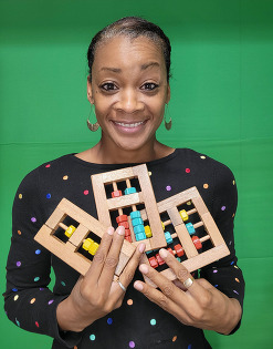 Dr. Ameerah Bello holding Junior Counters