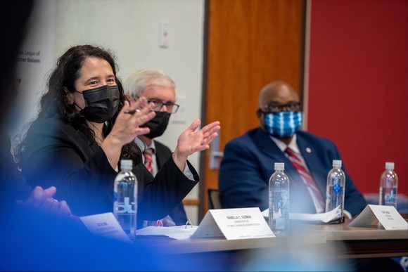 Photo of three people on a panel 