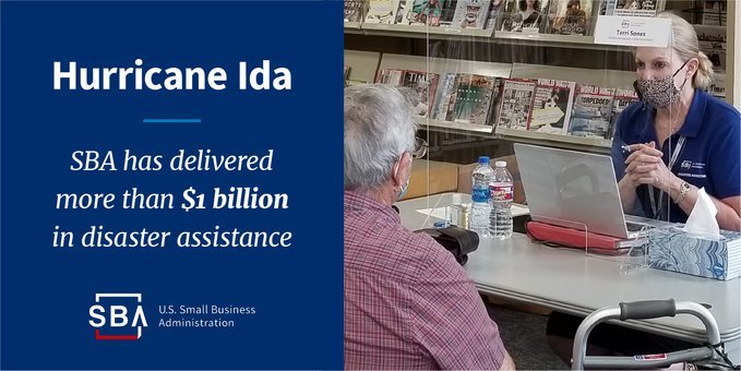 Photo of two people at a desk with the following text, Hurricane Ida, SBA has delivered more than $1 billion in disaster assistance 