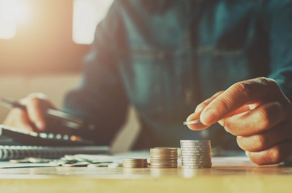 A man counting coins 