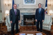 Secretary Blinken and Special Envoy Feltman standing in front of a fireplace.