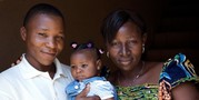 Photograph of a man, a woman, and a baby.