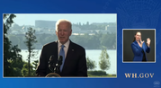 Screenshot of President Biden speaking, along with an ASL interpreter.