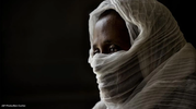 A woman wearing a headscarf. 