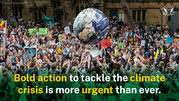 Image of a globe with a crowd of people and the words “Bold action to tackle the climate crisis is more urgent than ever.”