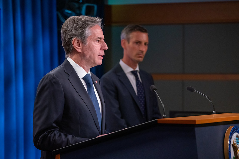 Photo of Secretary Blinken speaking at a podium with Spokesperson Ned Price in the background.
