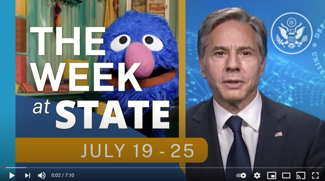 Screenshot of video of The Week At State, July 19-25, with Secretary Blinken next to Grover from Sesame Street.