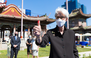 Deputy Secretary of State Wendy R. Sherman in front of the Choijin Lama Temple Museum in Ulaanbaatar, Mongolia, giving a thumbs up.