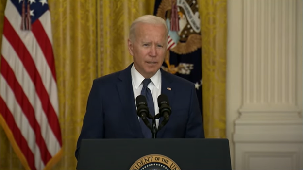 President Biden speaks at a podium