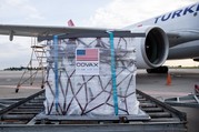 A pallet of vaccines labeled with the U.S. flag and the word 