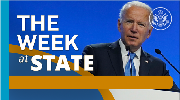 Screenshot of video of The Week At State showing President Biden speaking at a microphone.
