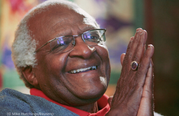 Desmond Tutu laughs during an interview. 