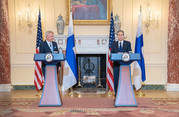 Secretary Blinken and Foreign Minister Haavisto stand at podiums with the State Department seal and with their country flags behind them.