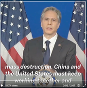 Screenshot of Secretary Blinken speaking at a podium in front of two U.S. flags.