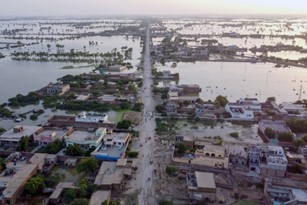 An aerial image of a town showing extensive flooding. 