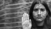 A young woman with words about violence against women – such as 