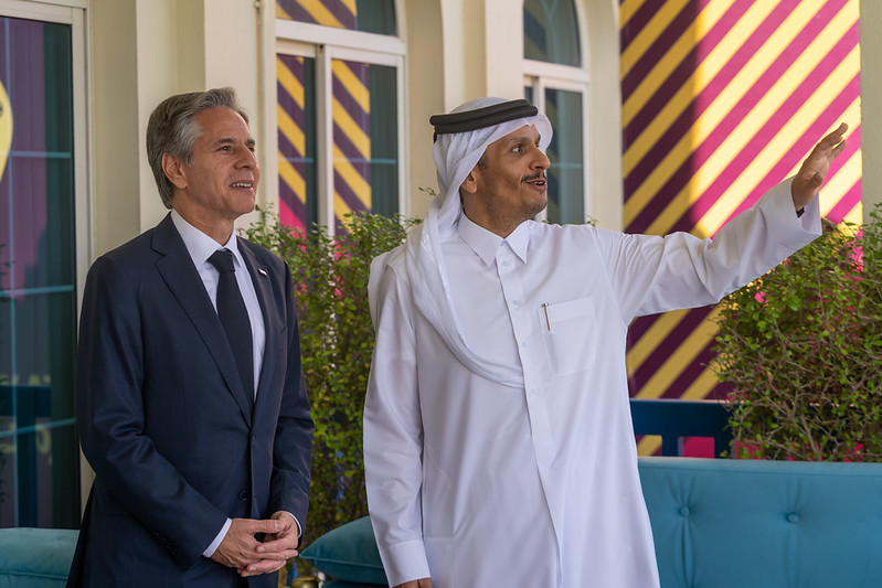 Secretary Blinken and  Deputy Prime Minister and Foreign Minister Mohammed bin Abdulrahman Al Thani stand outside on a terrace. 