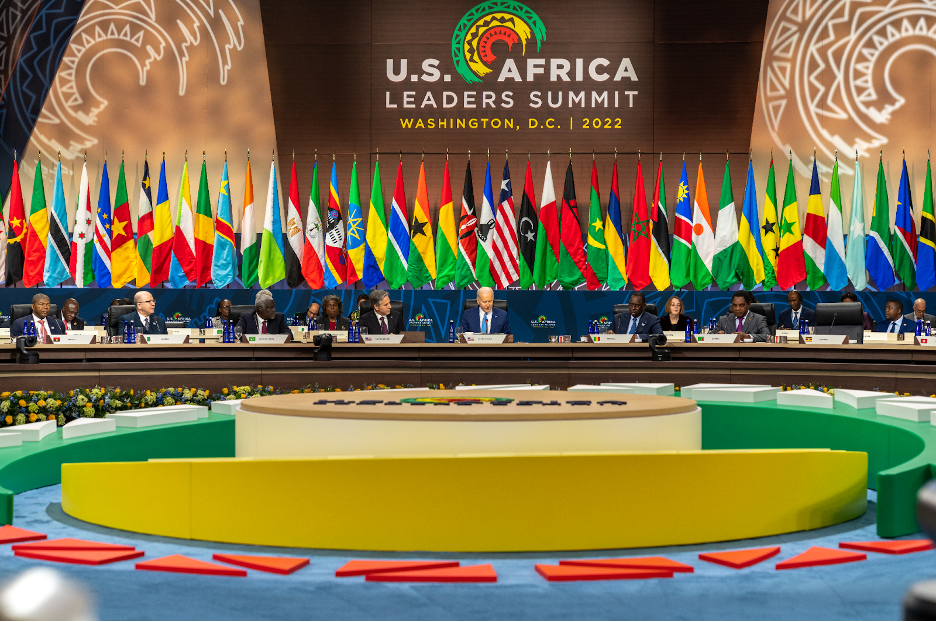 President Joe Biden and Secretary Blinken sitting amongst officials with African country flags behind them