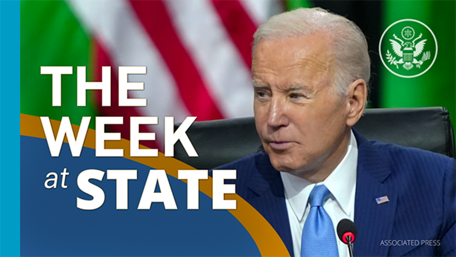 Screenshot of video of The Week At State showing President Biden seated, wearing a blue suit and tie.