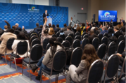Reporters raise their hands and ask questions of Secretary of State Antony J. Blinken at a press conference for the U.S.-Africa Leaders Summit.
