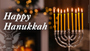 Happy Hanukkah graphic with a photo of a silver menorah with lit yellow candles. 