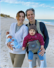  Family photo on a beach featuring Secretary of State Antony Blinken, his wife Evan Ryan, and their two children.