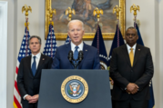 President Biden delivers remarks at a podium. Behind him stand Secretary Blinken and Secretary of Defense, Lloyd J. Austin III.