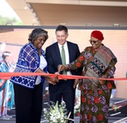 Ambassador Linda Thomas-Greenfield and two other officials cut the ribbon at the opening of the new embassy in Namibia
