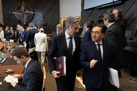 Secretary Blinken talks with a man as he prepares to participate in a North Atlantic Council meeting in Brussels, Belgium, December 4, 2024. 