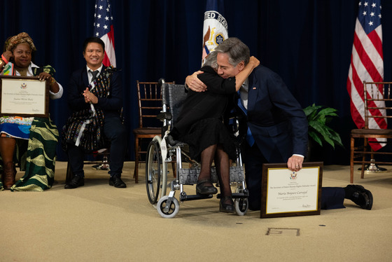 Secretary Blinken hugs Amparo Carvajal of Bolivia at the Human Rights Defender Award Ceremony.