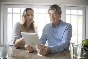 CogSMART image of two veterans looking at a tablet