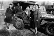 black female veterans in uniform during world war 2 in a jeep