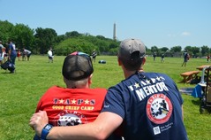 mentor and child sitting in front of washington monument