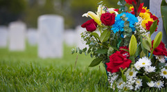 flowers next to headstone