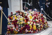 flowers at the base of the tomb of the unknown soldier