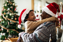 father and child embracing in holiday joy