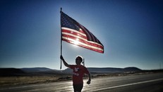 woman carrying flag while running