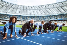 people in business attire on running track at starting line