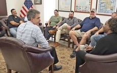 veterans sitting gathered in a group