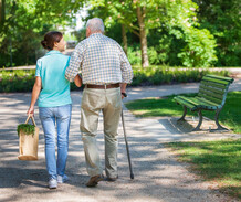 woman walking with elderly man