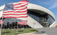 flag waving in front of national veterans memorial and museum