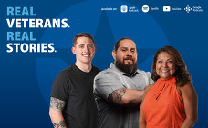 three veterans, two men and a woman, standing together