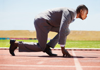man in business suit on running track